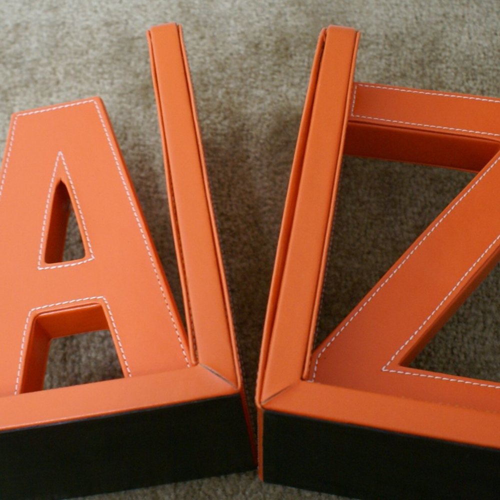 A - Z Bookends Book Books Orange Vinyl Faux Leather 8" Tall White Stitch Detail